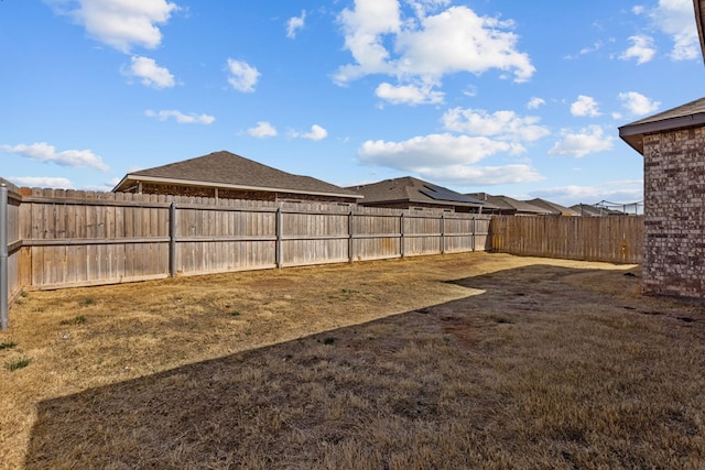 view of yard with a fenced backyard