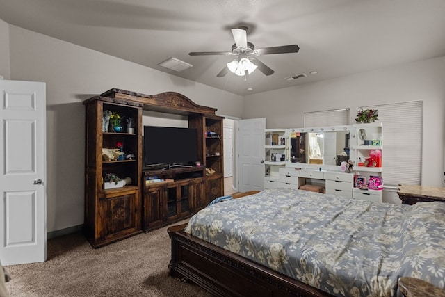 carpeted bedroom with a ceiling fan and visible vents