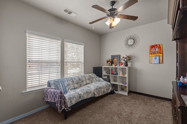 sitting room featuring carpet floors, a healthy amount of sunlight, visible vents, and baseboards