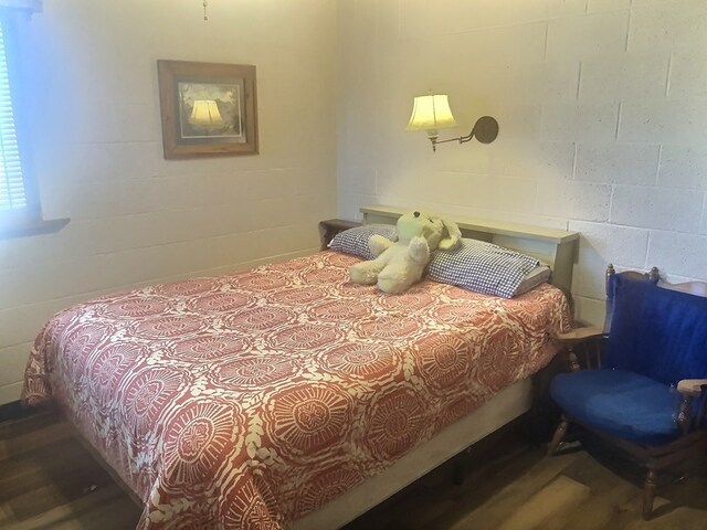 bedroom featuring hardwood / wood-style flooring