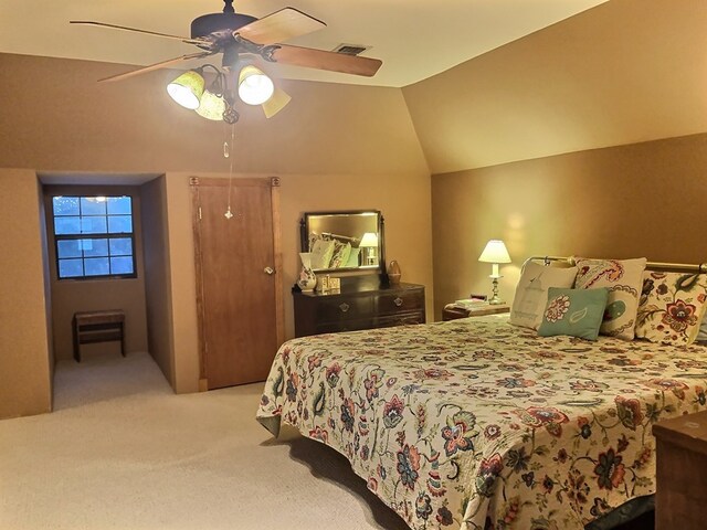 bedroom featuring ceiling fan, light colored carpet, and lofted ceiling