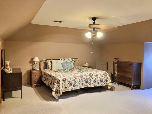 carpeted bedroom featuring ceiling fan and lofted ceiling