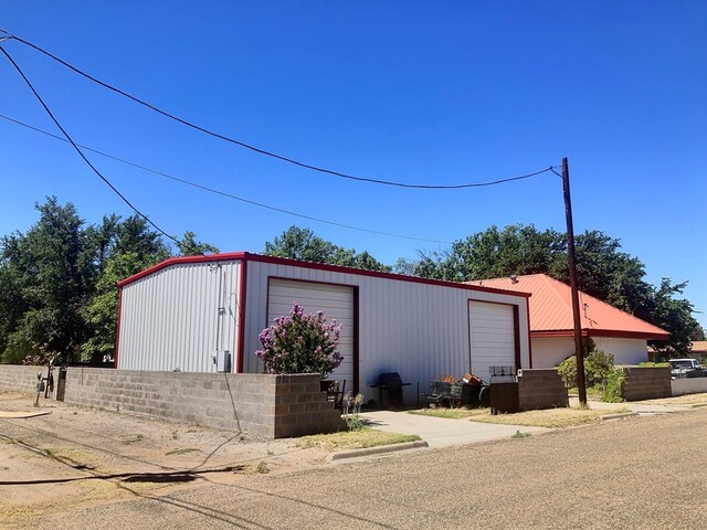 view of outbuilding featuring a garage