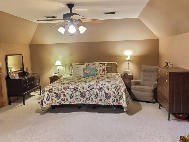 bedroom featuring ceiling fan, light colored carpet, and vaulted ceiling