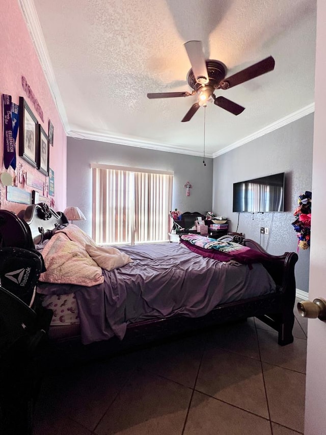 tiled bedroom with ceiling fan, a textured ceiling, and crown molding