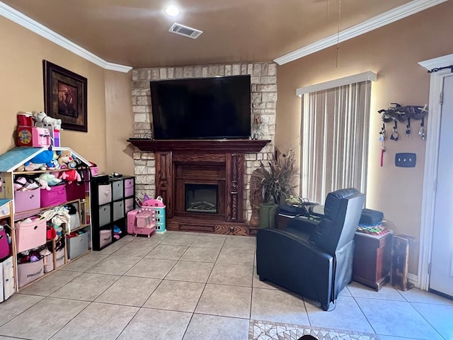 living area with ornamental molding, visible vents, a fireplace, and light tile patterned floors