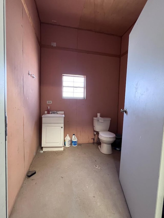 half bath featuring a sink and toilet