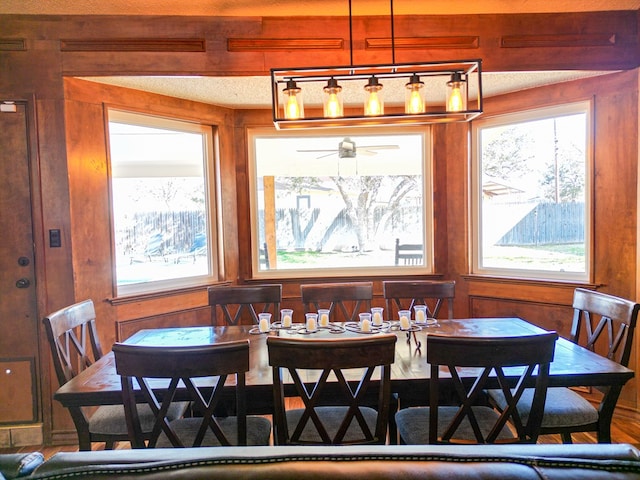 dining area with wooden walls