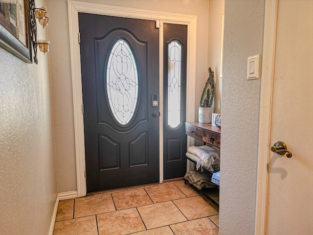 entrance foyer with light tile patterned floors