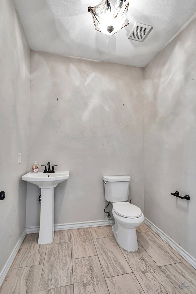 bathroom featuring toilet