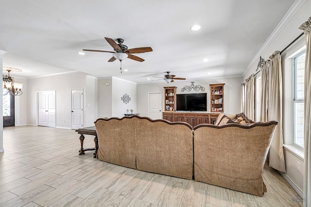 living room with light wood-type flooring, ornamental molding, and a wealth of natural light