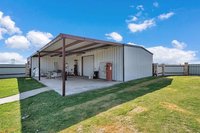 view of outbuilding featuring a lawn