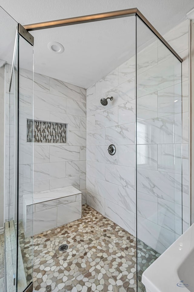 bathroom featuring an enclosed shower