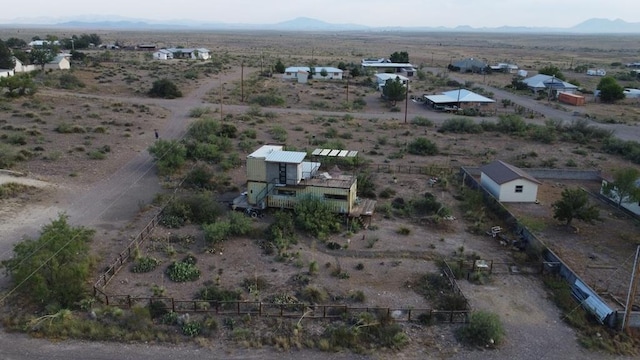 birds eye view of property with a mountain view and a rural view