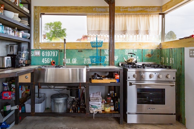 kitchen with designer range and concrete floors