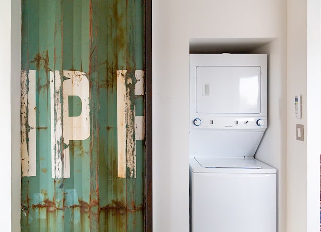 washroom with stacked washer / dryer