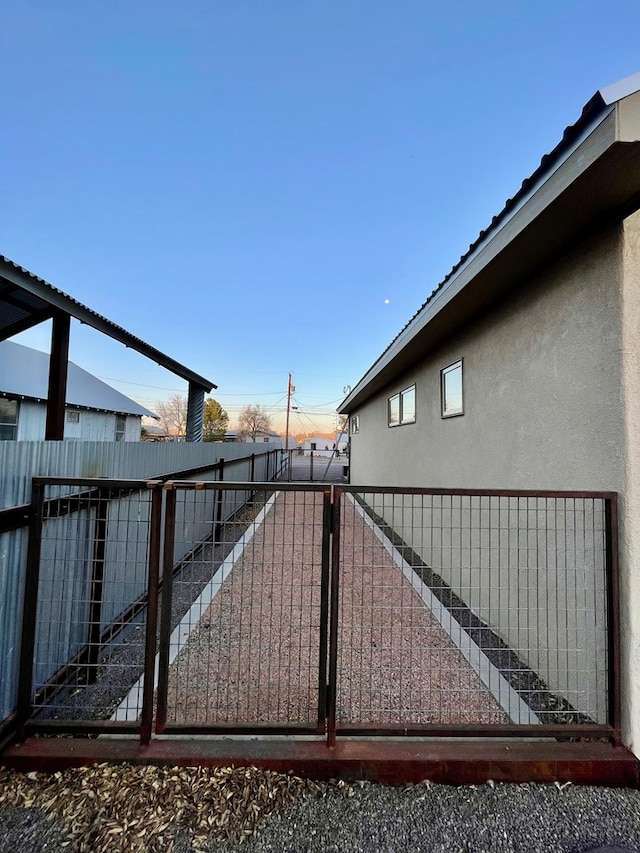 view of gate featuring fence