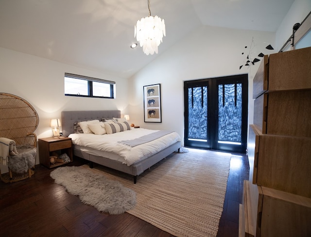 bedroom with a chandelier, high vaulted ceiling, a barn door, and wood-type flooring