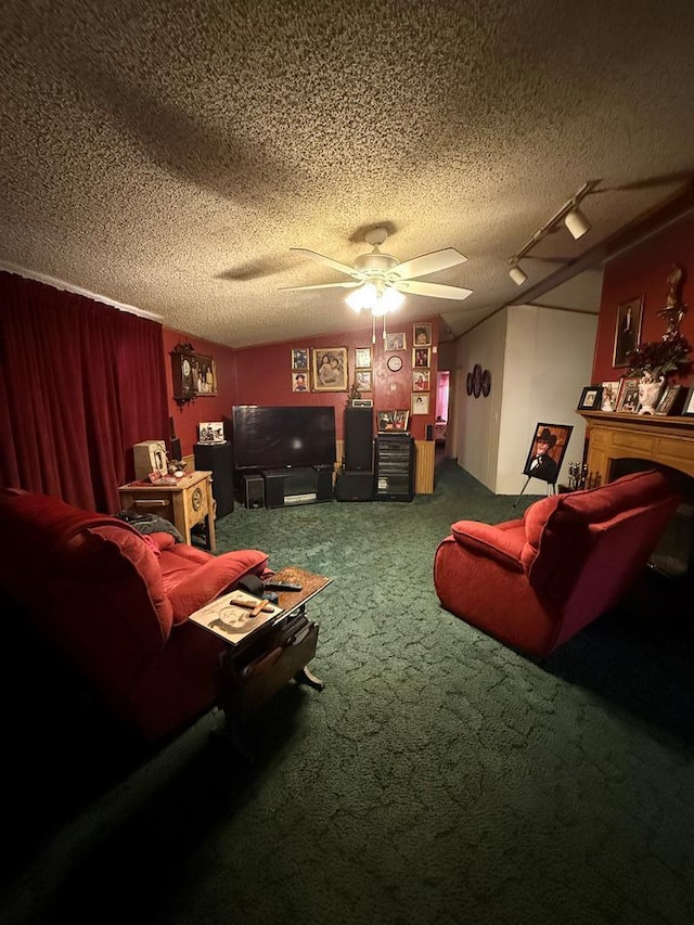 carpeted cinema room featuring a textured ceiling and ceiling fan