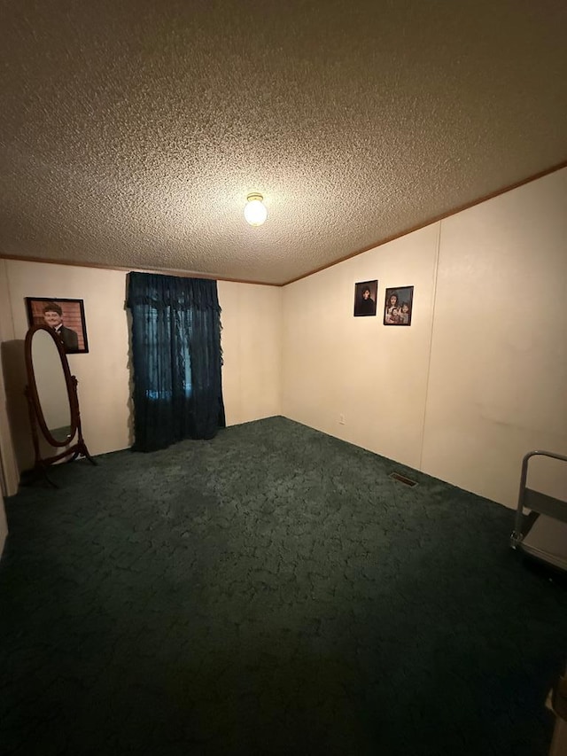 spare room with a textured ceiling