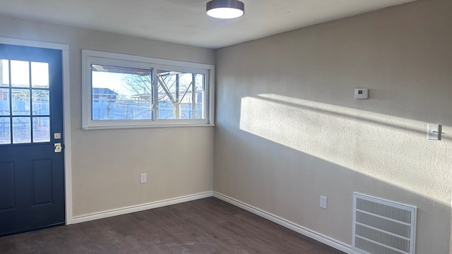 foyer entrance with dark hardwood / wood-style flooring