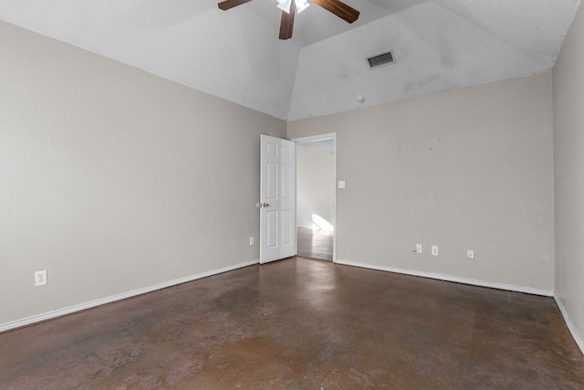 unfurnished room with visible vents, finished concrete floors, a ceiling fan, vaulted ceiling, and baseboards