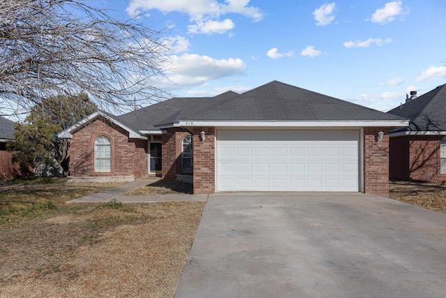 ranch-style house featuring a garage, roof with shingles, concrete driveway, and brick siding