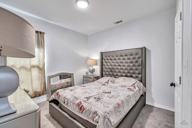 bedroom featuring carpet floors, visible vents, and baseboards