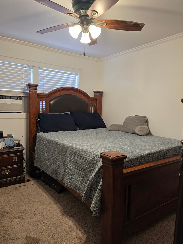 carpeted bedroom featuring ceiling fan and ornamental molding