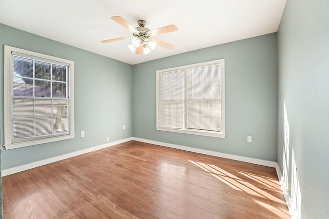 unfurnished room featuring ceiling fan and hardwood / wood-style floors