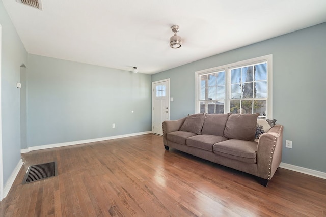 living room featuring dark hardwood / wood-style flooring