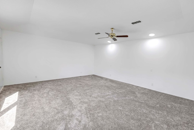 spare room with ceiling fan and carpet floors