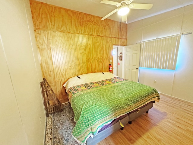 bedroom featuring wood-type flooring and ceiling fan