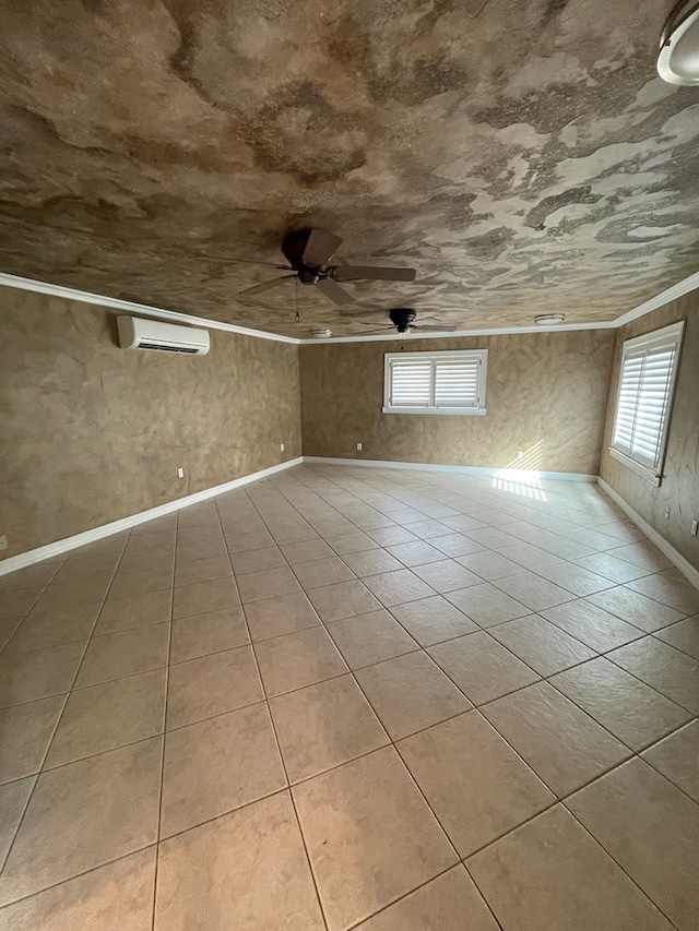 spare room with ceiling fan and a wall mounted AC