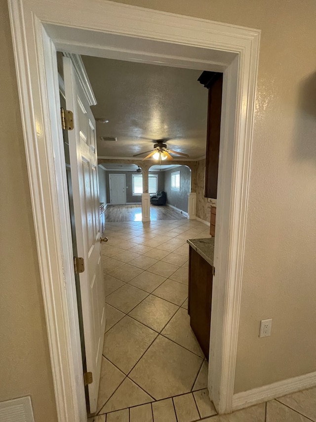 hallway featuring light tile patterned floors