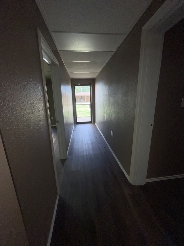 hallway with dark hardwood / wood-style floors