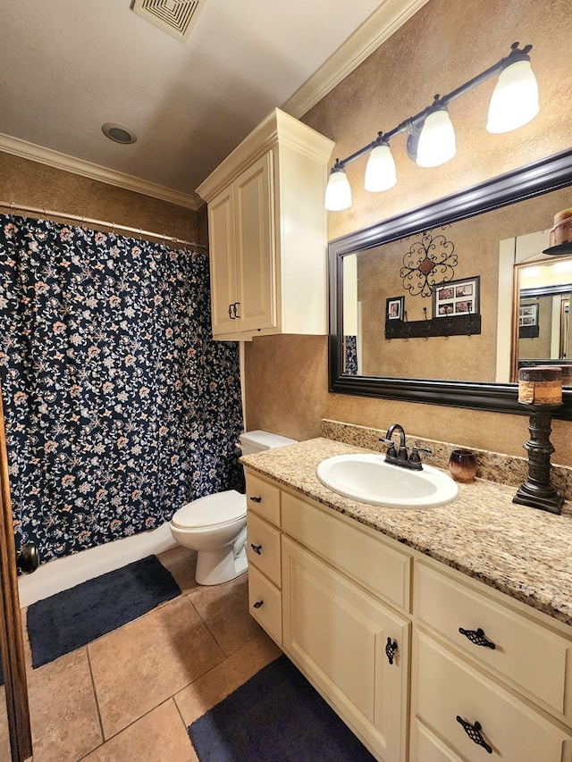 bathroom with vanity, tile patterned floors, ornamental molding, and toilet