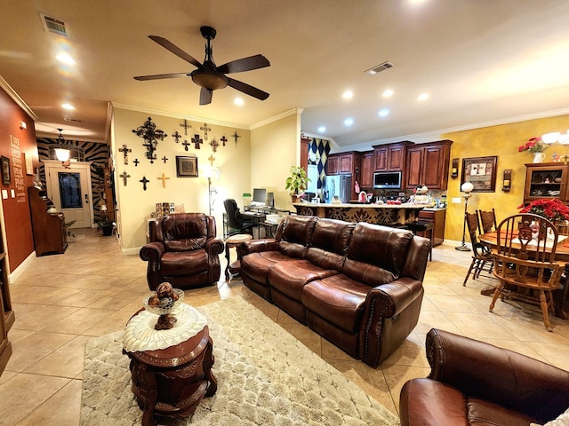 tiled living room featuring ceiling fan and ornamental molding