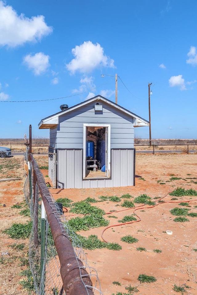 view of shed with fence