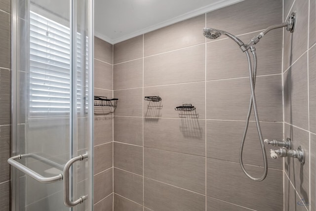 full bath featuring ornamental molding and a stall shower