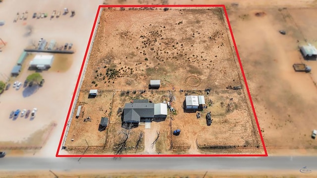 birds eye view of property featuring view of desert