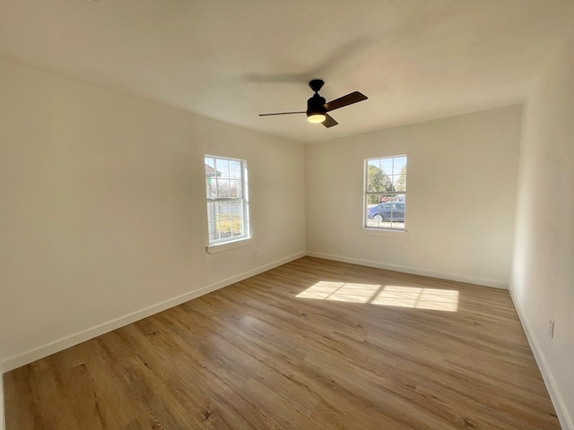 unfurnished room featuring ceiling fan and light wood-type flooring