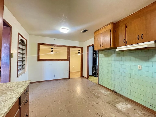 kitchen featuring ceiling fan