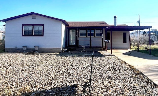 ranch-style home with a carport