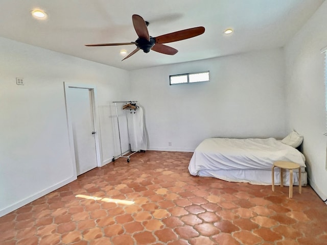 unfurnished bedroom featuring ceiling fan