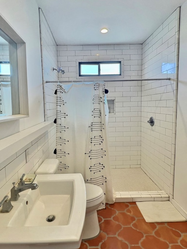 bathroom featuring backsplash, tile patterned floors, a shower with curtain, sink, and toilet