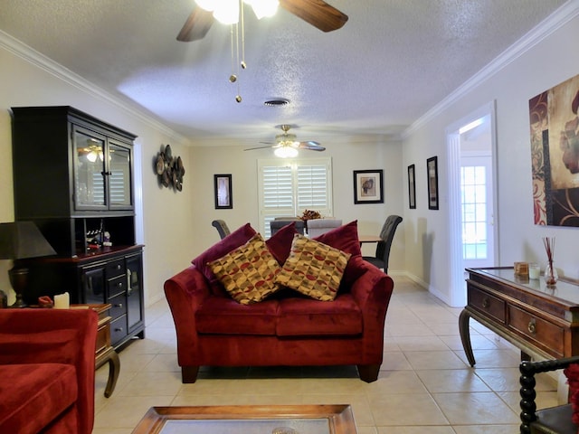 living room with light tile patterned floors, visible vents, ornamental molding, and a textured ceiling