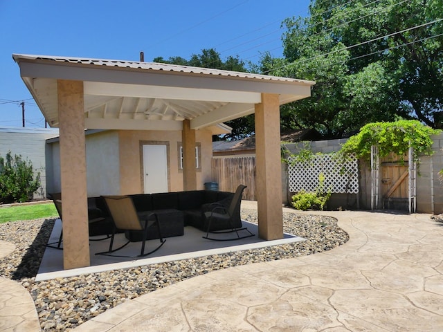 view of patio featuring fence and an outdoor living space