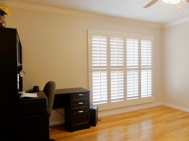 office space with ceiling fan, ornamental molding, baseboards, and light wood-style floors