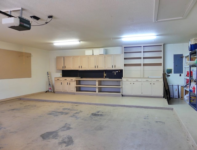 garage with a garage door opener and electric panel